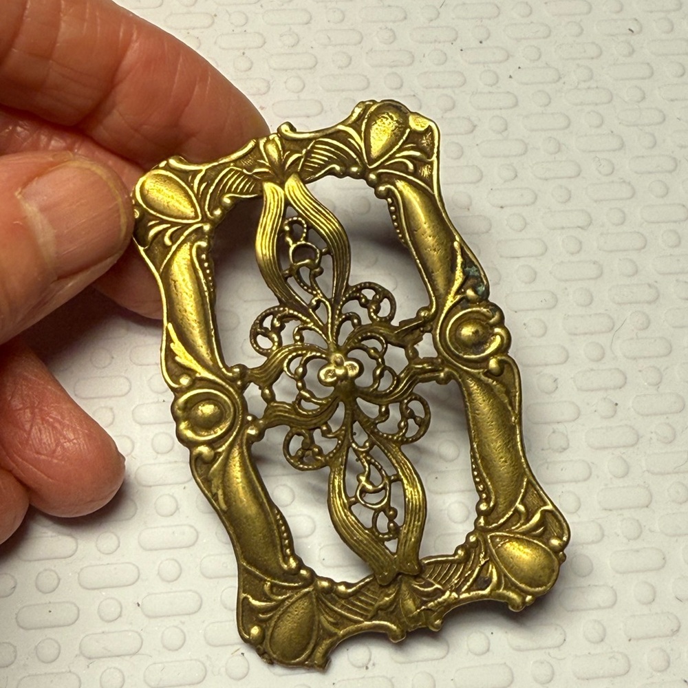 Ornate Gold Buckle marked with Roman numerals